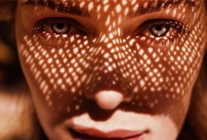 woman wearing sun hat, sun on face